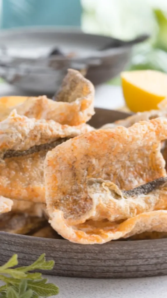 Crispy salmon skin chips, a tasty and nutritious snack made from oven-baked or fried salmon skins. This easy recipe transforms commonly discarded fish skins into golden, crunchy crisps packed with healthy omega-3 fatty acids. Enjoy these low-carb, high-protein salmon skin chips as a guilt-free alternative to potato chips, or serve them as an impressive appetizer at your next gathering.